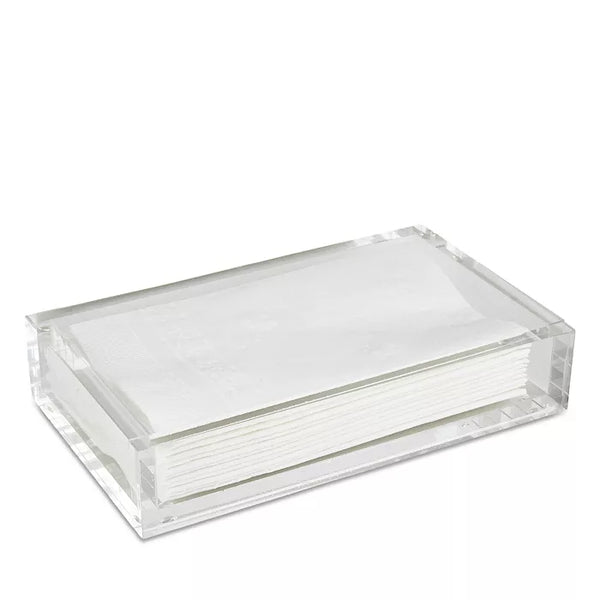 A stack of white paper napkins neatly arranged in the Caspari Acrylic Guest Towel Holder on a white background.