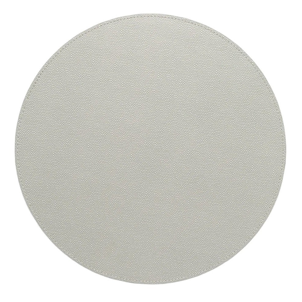 The Kim Seybert Shagreen Placemat Elephant Grey Set of 4 features plain, round placemats with a light textured finish, shown from above on a white background.