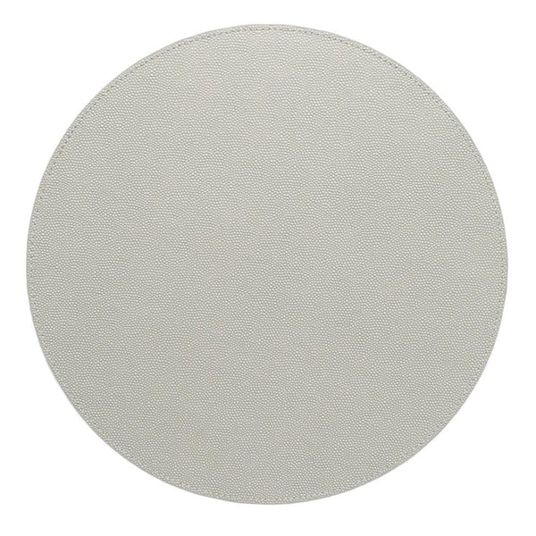 The Kim Seybert Shagreen Placemat Elephant Grey Set of 4 features plain, round placemats with a light textured finish, shown from above on a white background.