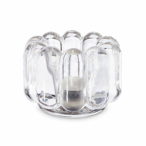 The Tom Dixon Press Vertical Tealight is a clear, sculptural glass holder featuring a rounded, bubble-like design that elegantly displays a small metallic candle at its center.