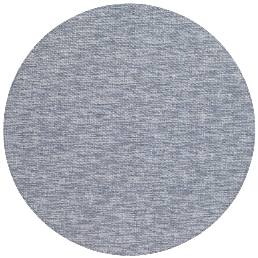 The Bodrum Pronto Placemat Round Set of 4 features light blue, textured, phthalate-free vinyl placemats with a subtle woven pattern. Durable and easy to clean, they're displayed on a white background.