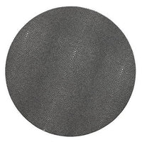 A large black circle densely patterned with small, irregular black dots on white, mirroring the textured elegance of the Kim Seybert Pebble Placemats Set of 4.