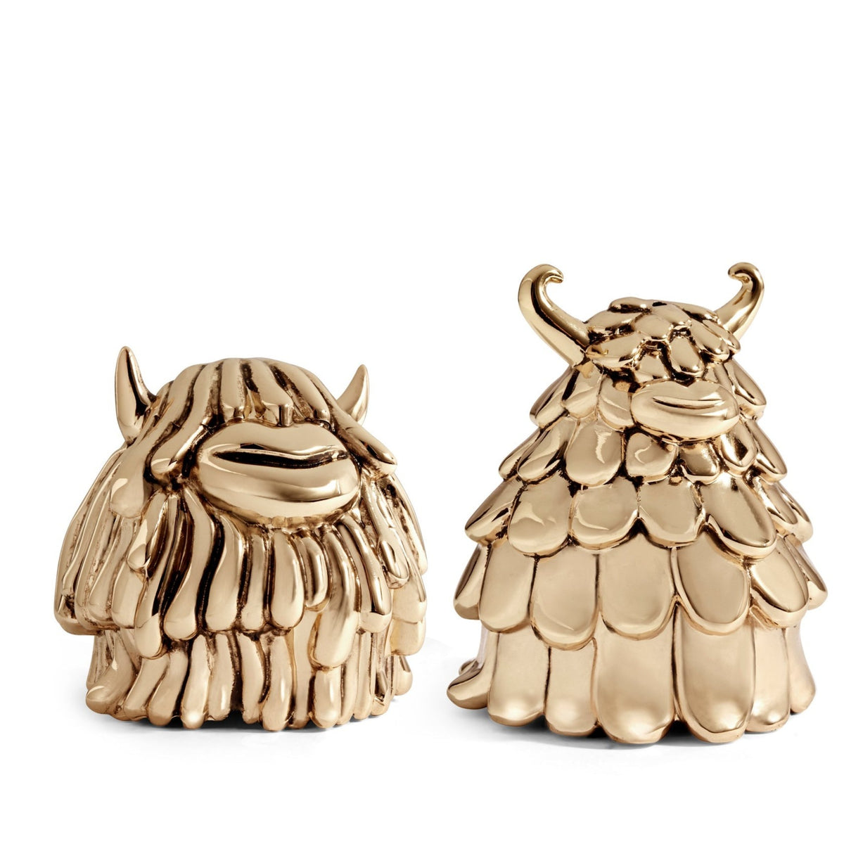 Niki & Simon Salt & Pepper shakers by Haas Brothers for L’Objet are shiny gold brass figurines resembling whimsical monsters with big mouths and horns, displayed against a white background.