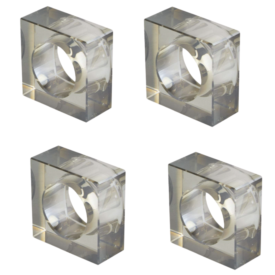 The Tizo Crystal Cube Napkin Ring Smoke Set of 4 features transparent, square crystal napkin rings with circular centers, arranged in a grid on a white background.