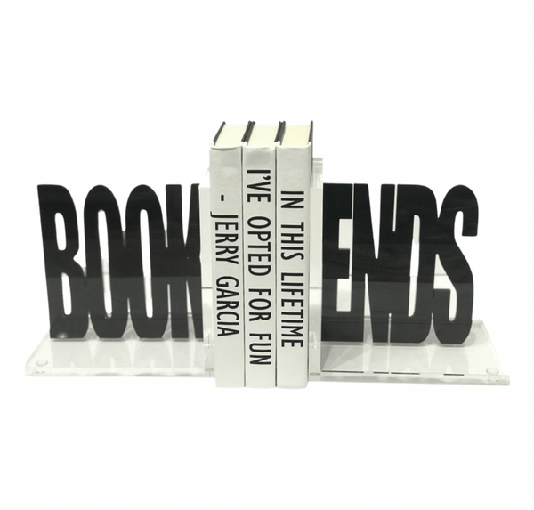 Eye Candy’s Book Ends Charcoal Acrylic spell out "BOOKENDS" in black acrylic, holding three white books with vertical black text: IN THIS LIFETIME I’VE OPTED FOR FUN - JERRY GARCIA. A playful touch for study decor.