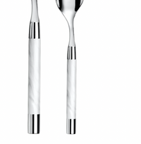 Two stainless steel spoons with glossy white marbled handles from Capdeco's Conty Flatware 5-Piece Setting - White are displayed side by side, ideal for enhancing any elegant tabletop arrangement.