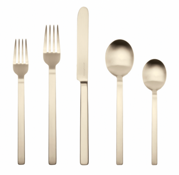 The Mepra Stile 5 Piece Setting - Champagne features two forks, a knife, a tablespoon, and a teaspoon with straight, modern handles and an elegant champagne finish.