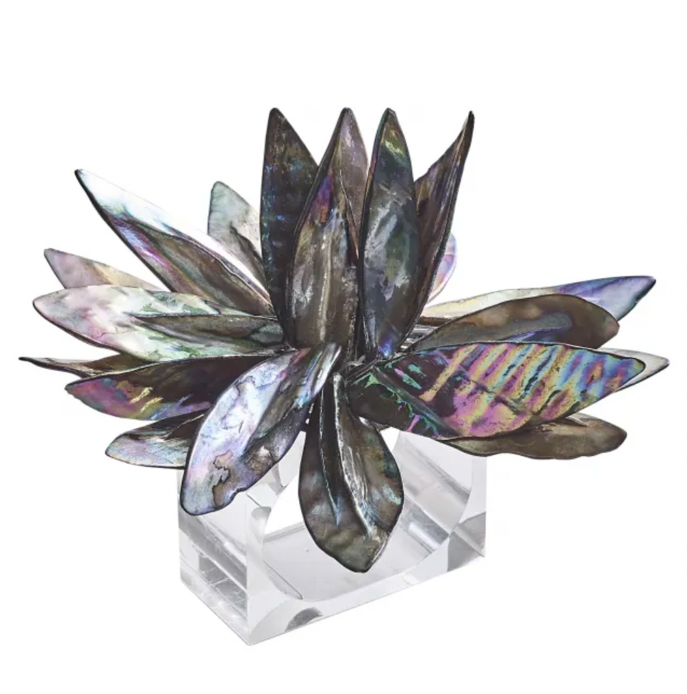 The Kim Seybert Shell Flower Napkin Ring Set of 4 features modern lotus-inspired designs crafted from multicolored iridescent river shells, each presented on a clear acrylic base for elegant tabletop decor.