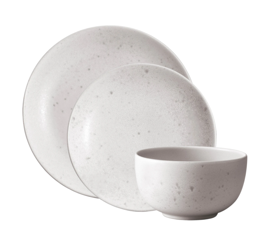 Three-piece Terra Stone Dinnerware by L'Objet: a large plate, medium plate, and bowl featuring a subtle gray speckle pattern, inspired by the Terra Collection, arranged against a white background.