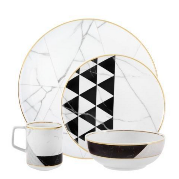 Vista Alegre’s Carrara by Coline Le Corréa Dinnerware set features a large plate, small plate, mug, and bowl in porcelain with gold rims, Carrara marble pattern, and bold black geometric triangles.