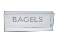 The Eye Candy Bagel Tray is a clear rectangular acrylic box with "BAGELS" in bold capital letters on the front, food safe, empty, and shown against a plain white background.