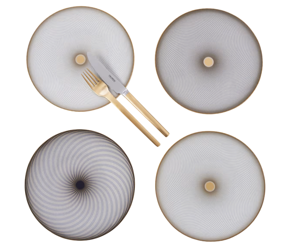 Four Oskar Dinnerware plates by Raynaud, crafted from fine Limoges porcelain, display gradient geometric patterns. Arranged in a grid, a gold-handled fork and knife rest diagonally on the top left plate.