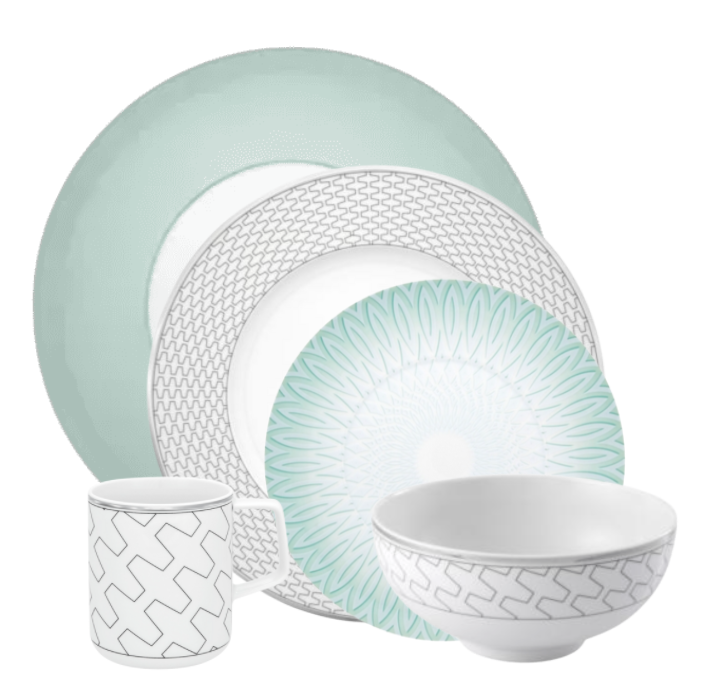 The Trasso Dinnerware set by Vista Alegre includes five pieces: a mint green dinner plate, two geometric platinum-accented white plates, a patterned bowl, and a matching mug.