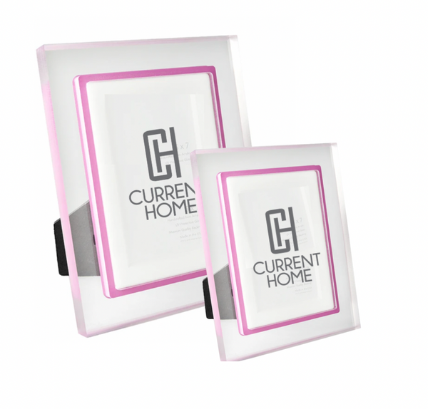 The Prisma Lip Frame - Fuschia by Bella Moulding includes two clear acrylic frames with pink borders in different sizes, each with a black stand for display and a branded insert.