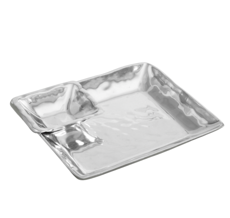 The Beatriz Ball Linda Chip & Dip Set is a shiny, square metallic tray with a smaller corner compartment, oven and freezer safe, shown on a white background.