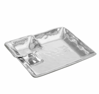 The Beatriz Ball Linda Chip & Dip Set is a shiny, square metallic tray with a smaller corner compartment, oven and freezer safe, shown on a white background.