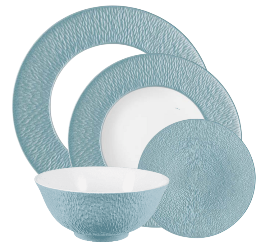 The Raynaud Mineral Irise Dinnerware Sky Blue set features four Limoges porcelain pieces—a large plate, medium plate, small plate, and a bowl with a blue exterior and white interior.