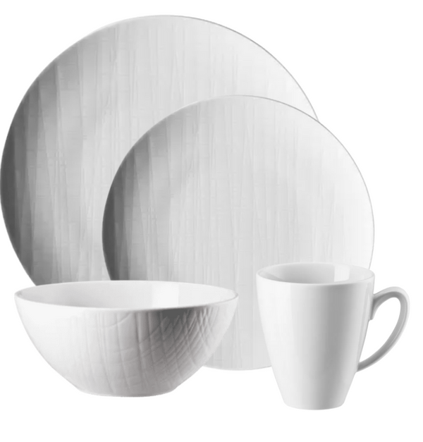 The Mesh Dinnerware White set by Rosenthal features two plates, a bowl, and a mug with a subtle textured pattern, all displayed on a white background. Dishwasher safe for easy cleaning.