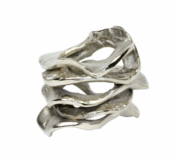 The Kim Seybert Flux Napkin Ring Silver Set of 4 features sculptural, wavy layers in an abstract, textured design. Photographed on a white background, these elegant rings add a modern touch to any table setting.