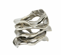 The Kim Seybert Flux Napkin Ring Silver Set of 4 features organically shaped, wave-like rings that add an elegant touch to your table decor, shown here against a white background.