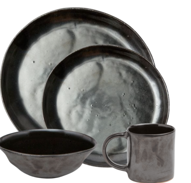 Blue Pheasant’s Marcus Black Dinnerware Set of 4 features organic silhouettes: two round plates, a bowl, and a mug in dark matte stoneware with a subtle marbled texture.