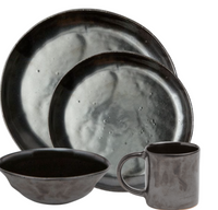 Blue Pheasant’s Marcus Black Dinnerware Set of 4 features organic silhouettes: two round plates, a bowl, and a mug in dark matte stoneware with a subtle marbled texture.