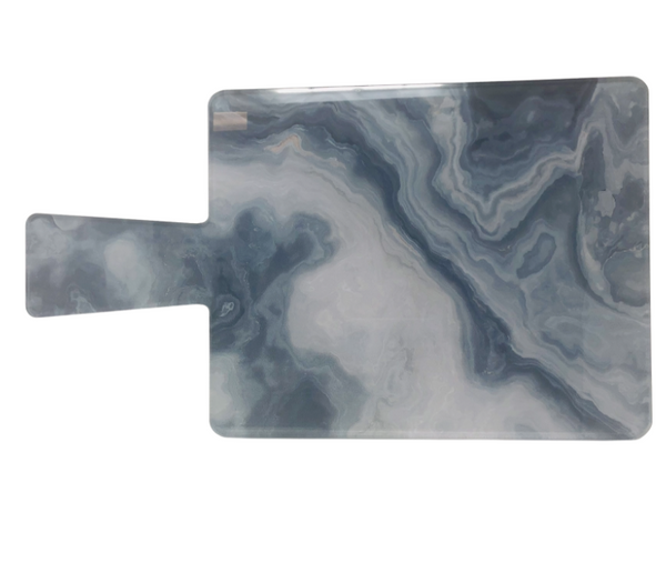 The Eye Candy Charcuterie Board Paddle | Smoky Illusion is a rectangular acrylic board with a handle, showcasing a smoky blue and white marbled pattern—ideal for serving cheese and entertaining guests.