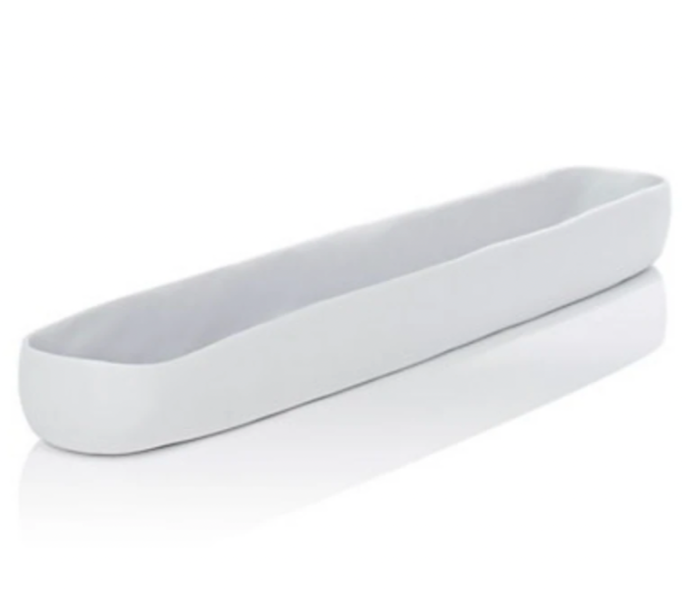 The Tina Frey Resin Trough White Long is an elegant, oval-shaped tray with smooth, slightly irregular edges, ideal as a serving piece or table decor, shown on a white surface.