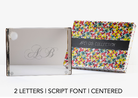 A Personalized Solid Acrylic Challah Board by Apeloig, engraved with script letters A B, is shown beside a colorful geometric Apeloig box. Text reads: 2 LETTERS | SCRIPT FONT | CENTERED.