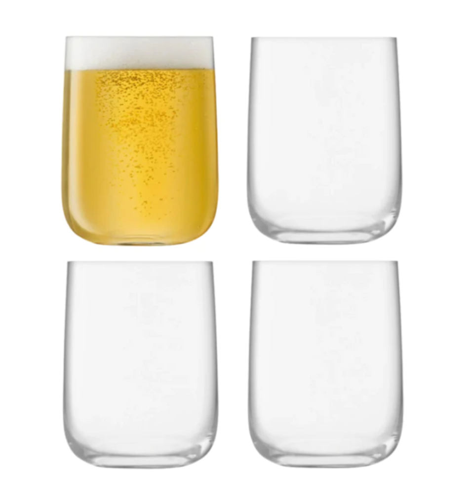 Four Borough Barware glasses by LSA are arranged in a grid; the top left glass holds a yellow fizzy drink with foam, while the other three are empty—an elegant set of stemless glasses for any barware collection.