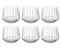 The Bernadotte Glassware Set of 6 by Georg Jensen showcases clear, short tumbler glasses with faceted sides in Scandinavian design, arranged in two rows of three against a white background for a timeless look.