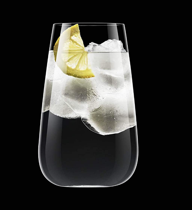 A Luigi Bormioli Talismano Bar Collection glass, filled with ice, water, and a lemon wedge, is set against a solid black background.