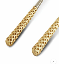Close-up of two gold-toned, textured handles from the Braid Serving Set Gold L'Objet by L'Objet, shown on a white background.