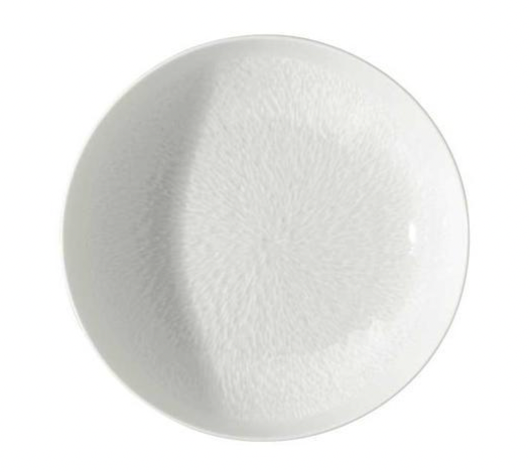 The Mineral Dinnerware Glazed White plate by Raynaud is a round, white Limoges porcelain plate with a subtle textured pattern radiating from the center and a smooth, glossy finish, shown from above.