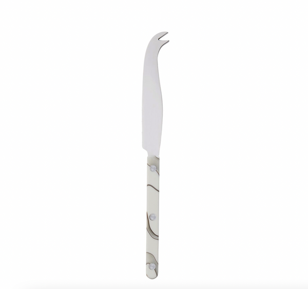 The Sabre Dune Bistrot Cheese Knife Ivory features a curved stainless steel blade, forked tip, and an ivory handle with a wavy gray pattern—an elegant addition to your French restaurant flatware collection, shown on a white background.