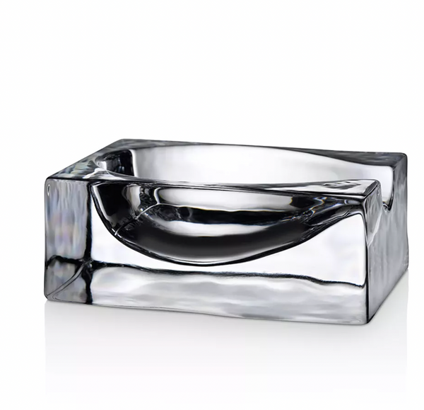 The Nude Glassware Glass Modern Spoon Rest features a clear, rectangular lead-free crystal design with smooth, curved edges and a shiny finish, shown on a white background.