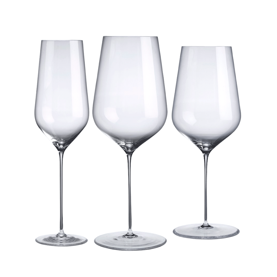 Three clear, lead-free crystal wine glasses from Nude Glassware's Stem Zero Barware collection are displayed side by side in various shapes and sizes against a white background.