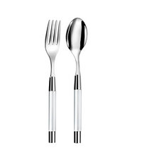 The Capdeco Zoe Salad Serving Set features a stainless steel fork and spoon with reflective finishes and modern handles. Placed side by side on a white background, both dishwasher safe for elegant serving.