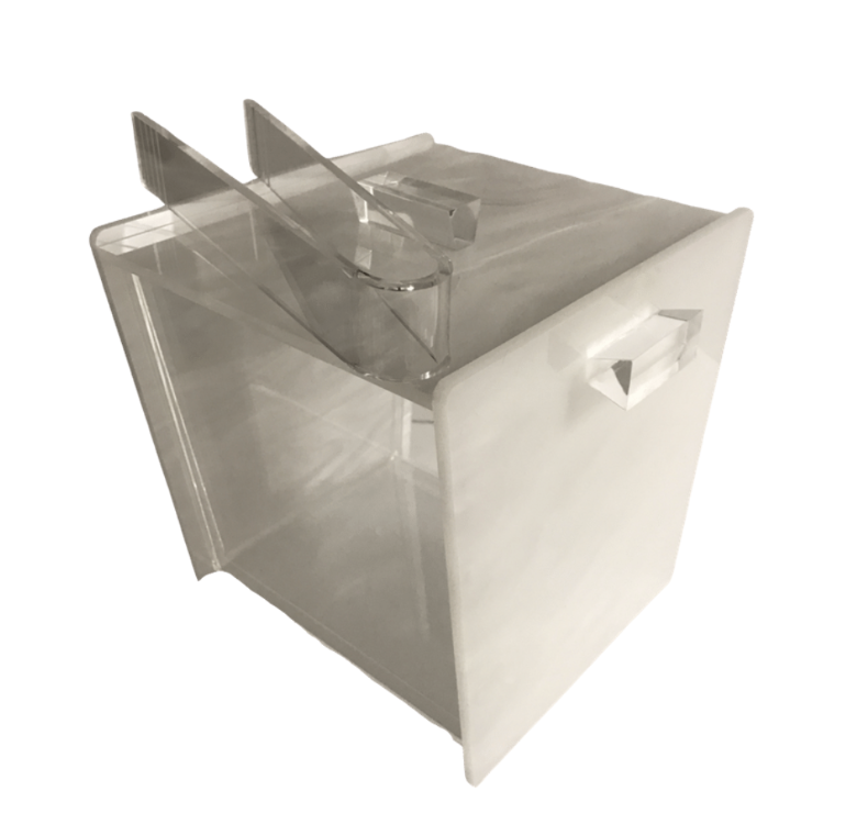 The Eye Candy Acrylic Ice Bucket White Marble has a transparent, rectangular design with angled dividers creating two triangular compartments, a convenient front handle, and an easy-to-clean liner.