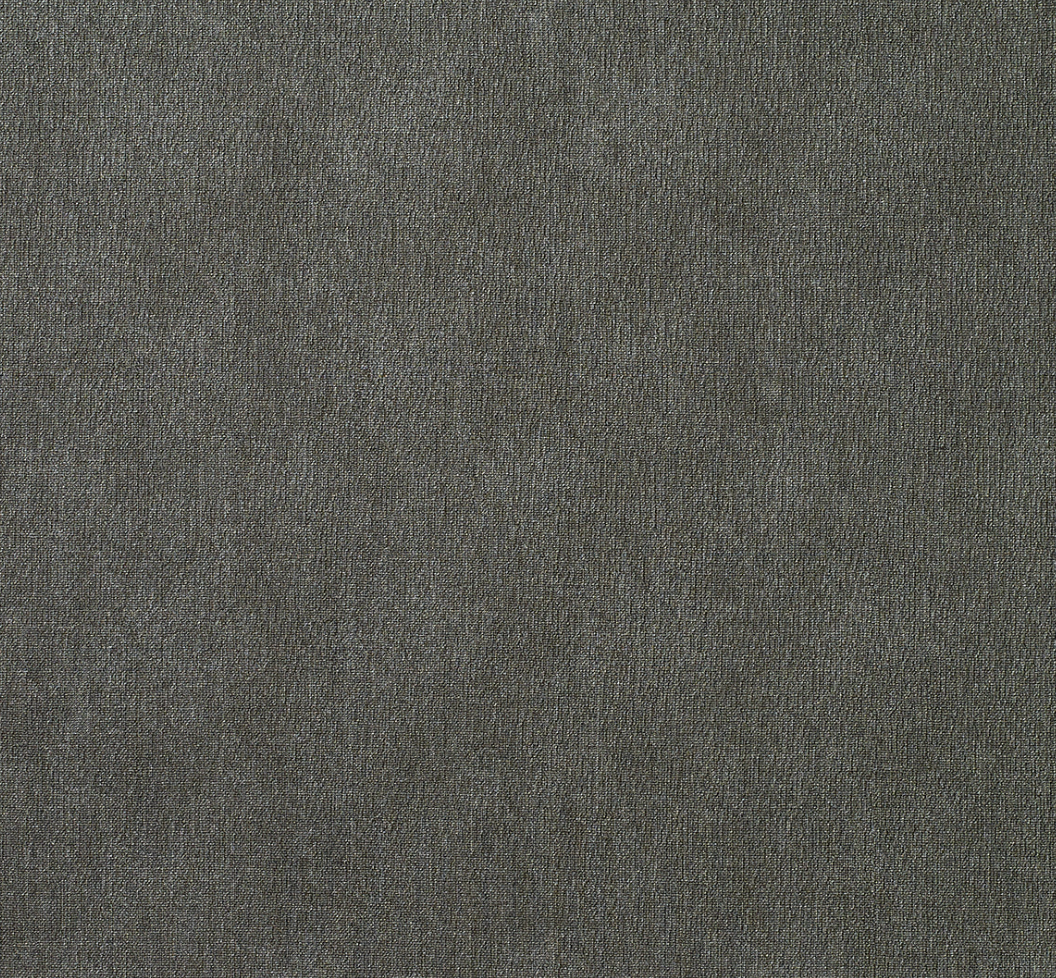 A close-up of the Bodrum Presto Placemat Round Charcoal Set of 4 shows dark grey textured fabric with a subtle pattern and fine woven threads, designed for easy care and everyday use.
