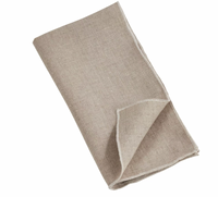 A folded beige napkin from the Saro Trading Stitched Stone Washed Napkin Set of 4, crafted from 100% linen with a simple, plain design and subtle stitched borders, displayed on a white background.