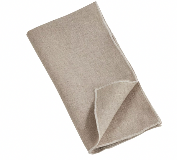 A folded beige napkin from the Saro Trading Stitched Stone Washed Napkin Set of 4, crafted from 100% linen with a simple, plain design and subtle stitched borders, displayed on a white background.
