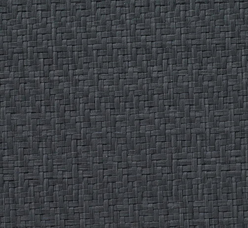 The Bodrum Wicker Round Placemat Black Set of 4 features a dark gray, basket-weave design with phthalate-free vinyl, offering stylish, easy-care mats with tightly woven horizontal and vertical strands.