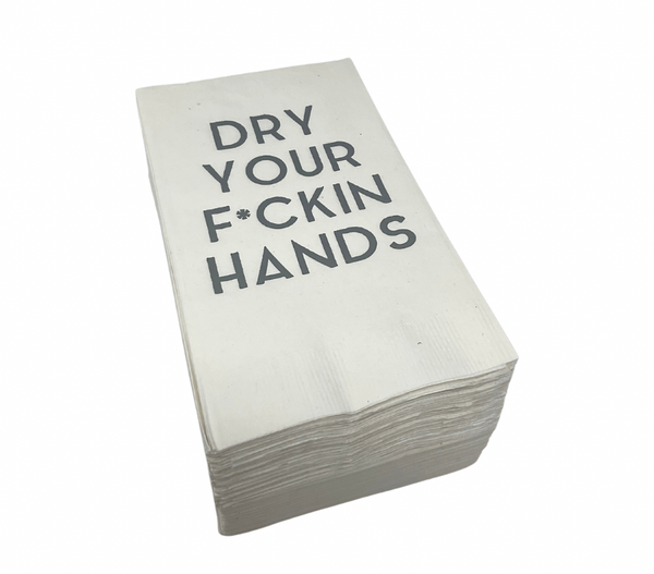 The Print Appeal Guest Hand Towel Pack features white disposable napkins with "DRY YOUR F*CKIN HANDS" in bold black print, perfect for guest bathrooms or pairing with an acrylic napkin holder.