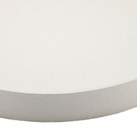 A close-up of the Bodrum Skate Round Oyster Tray, featuring a white, textured surface and slightly curved edge, shown against a plain background.