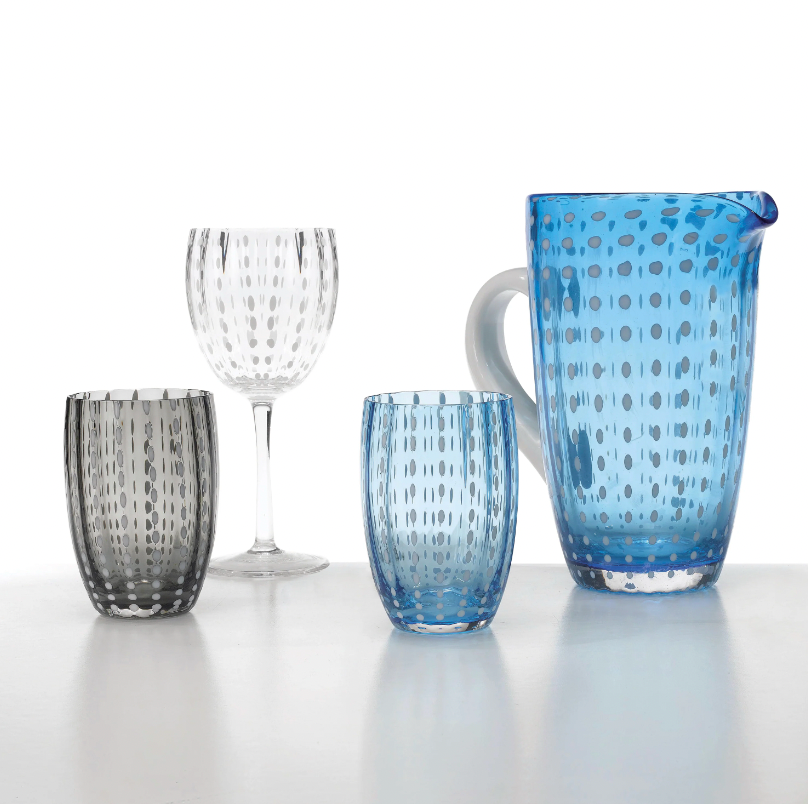 The Zafferano Perle Beverage Glass Set of 2 by Federico de Majo features designer glasses with dotted patterns, shown on a white surface against a light background.