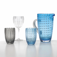 The Zafferano Perle Beverage Glass Set of 2 by Federico de Majo features designer glasses with dotted patterns, shown on a white surface against a light background.