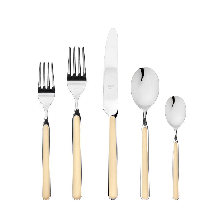 The Fantasia Flatware 5 Piece Set by Mepra features polished silver tops and cream resin handles. It includes two forks, a knife, a spoon, and a teaspoon, arranged vertically on a white background. Available in 16 colors!.