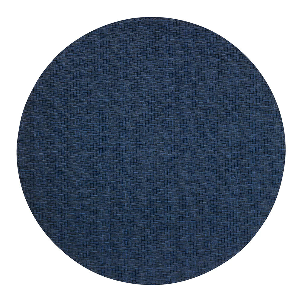 The Bodrum Wicker Round Placemat Navy Set of 4 features dark blue, woven placemats crafted from easy-care materials, shown against a white background.
