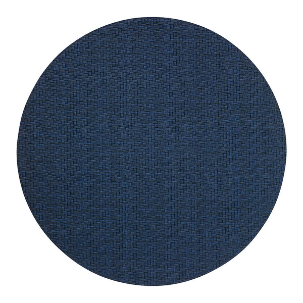 The Bodrum Wicker Round Placemat Navy Set of 4 features dark blue, woven placemats crafted from easy-care materials, shown against a white background.